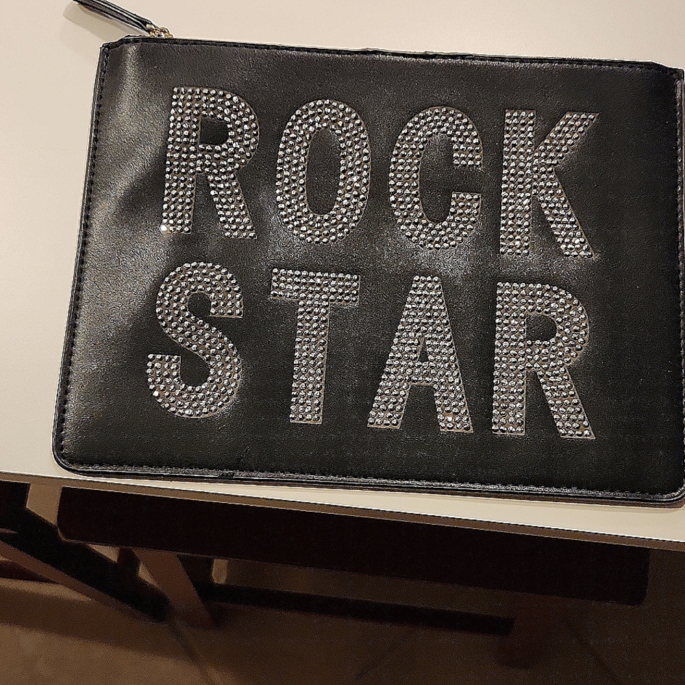 Black clutch purse with Rock Star in rhinestones. Great for casual and parties.